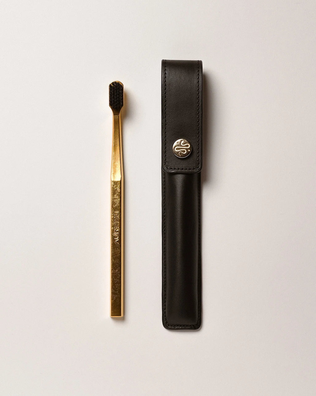 BLACK LEATHER CASE BUTTON & TOOTHBRUSH