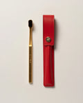 RED LEATHER CASE BUTTON & TOOTHBRUSH