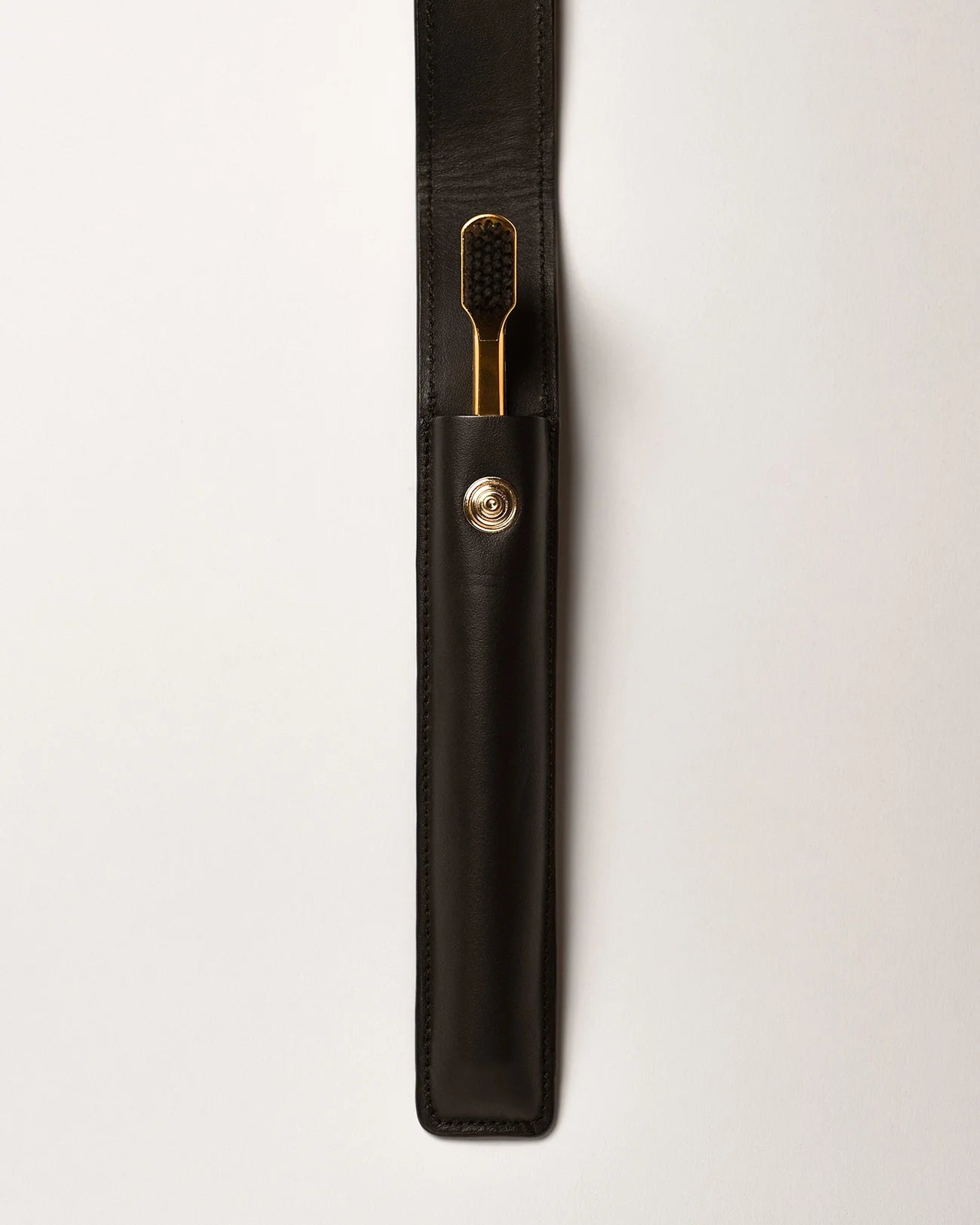 BLACK LEATHER CASE BUTTON & TOOTHBRUSH